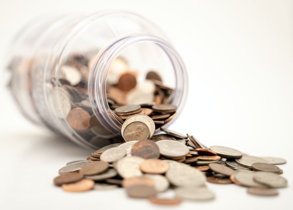 pennies spilling out of a jar